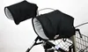 A close-up shot of black hand warmers attached to the handles of a rollator walker. Produktbild-Vorschau