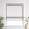 A window with a gray roman shade, decorated with small dangling beads, is shown in a room with a plant on the left and a nightstand with a vase of flowers and a glass of juice on the right. Produktbild-Vorschau