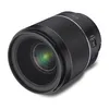 A close-up studio shot of a black camera lens against a white background. Anteprima dell’immagine prodotto