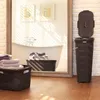 A bathroom scene with laundry baskets and towels. Podgląd zdjęcia produktu