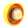 A close-up, angled view of the inside of a yellow cap with multiple seals and a small white component with the number '700' printed on it. Náhled obrázku produktu