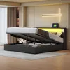 A modern bedroom with a bed that has its storage compartment open, revealing stored items. The bed has LED lighting. Náhľad obrázku produktu