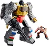 Two Transformers action figures, a large gray and gold robot and a smaller orange robot, are posed against a white background. Náhľad obrázku produktu