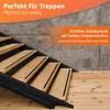 A close-up view of wooden stairs with black anti-slip strips, set against a concrete wall. Produktbild-Vorschau