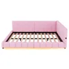 A pink upholstered daybed frame with a slatted mattress support is shown from a side-angle on a white background. Podgląd zdjęcia produktu