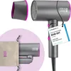 A hairdryer and its accessories are displayed against a white and light purple background. A tag with product information is attached to the hairdryer. Produktbild-Vorschau