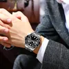 A man wearing a suit and watch. Produktbild-Vorschau
