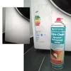 A spray can of cleaning product next to a washing machine with an energy label. Produktbild-Vorschau