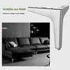 A close-up of a metal furniture leg next to a sectional sofa in a modern living room. Produktbild-Vorschau