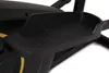 A close-up view of the pedal of a black elliptical trainer with gold accents. Podgląd zdjęcia produktu