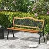 A garden bench is placed on a patio in front of a lush green hedge and flowering plants. Produktbild-Vorschau