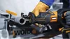 A person wearing gloves is using a reciprocating saw to cut a pipe. Voir les images du produit