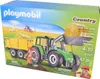 A Playmobil Country tractor with trailer toy set packaging, showing the toy in a farm setting. Voir les images du produit