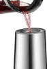 Red liquid being poured from a glass carafe into a silver insulated jug. Voir les images du produit