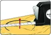 A tape measure is being used to draw a circle on a piece of wood, with a nail acting as the pivot point. Anteprima dell’immagine prodotto