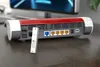 A USB transceiver is placed in front of a router on a wooden desk. Anteprima dell’immagine prodotto