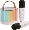 A karaoke speaker and two microphones are displayed against a white background. Produktbild-Vorschau