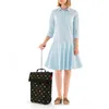 A person is standing next to a rolling shopping bag. Produktbild-Vorschau