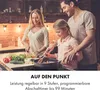 A family cooking together in a kitchen. Produktbild-Vorschau