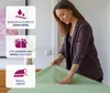 A woman is shown folding a light green tablecloth on a table. Produktbild-Vorschau