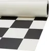 PVC-Rolle in schwarz-weiß im Schachbrettmuster, halb ausgerollt auf weißem Untergrund
 Produktbild-Vorschau