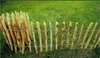 A wooden picket fence is installed in a grassy area, possibly a garden or yard. Produktbild-Vorschau