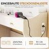 A close-up of a white vanity table with a hairdryer plugged into a built-in power outlet. The image highlights the integrated power strip and USB ports. Voir les images du produit