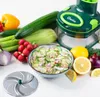 A collection of fresh vegetables and a food chopper, arranged on a white surface. Anteprima dell’immagine prodotto