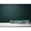 Several product packages are arranged on a white surface against a dark teal background. Produktbild-Vorschau