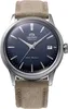 A close-up studio shot of an Orient watch with a blue dial and a brown strap. Voir les images du produit