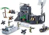A collection of toy military building blocks depicting a World War II-themed scene, including a fort, vehicles, and figures. Podgląd zdjęcia produktu