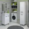 A modern bathroom with a vanity, washing machine, and storage cabinet. Produktbild-Vorschau