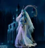 A figurine of Emily from Corpse Bride standing in front of a dark, gothic-style building. Náhled obrázku produktu