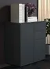 A dark gray sideboard with books and a floral arrangement on top, set against a dark wall and a slatted wooden panel. Produktbild-Vorschau