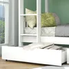 A close-up view of a white bunk bed with pillows and bedding, showing a drawer underneath. Náhľad obrázku produktu