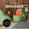 Two beanbag chairs, one shaped like a dinosaur, are placed on a rug in front of a bamboo-like wall. There are plants and a ladder with blankets in the background. Anteprima dell’immagine prodotto