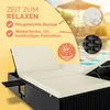 A sun lounger with cushions next to a swimming pool. Produktbild-Vorschau