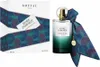 A perfume box and bottle are displayed side-by-side against a white background. Voir les images du produit