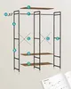 An unassembled wardrobe with labeled parts and an open instruction manual at the bottom right. Produktbild-Vorschau