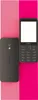 A black Nokia 235 DS 4G smartphone is shown from the front and back against a split pink and hot pink background. Podgląd zdjęcia produktu