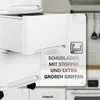 Close-up of a white plastic drawer unit with a textured front, showing the drawers partially open. A graphic overlay highlights product features. Produktbild-Vorschau