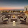 A rooftop patio with seating and a fire pit overlooking the ocean at sunset. Náhled obrázku produktu