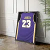 A framed basketball jersey is displayed leaning against a wall. Náhled obrázku produktu