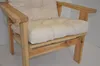 A close-up view of a beige cushion on a wooden garden chair. Produktbild-Vorschau