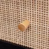 Close-up of a wooden knob on a woven surface. Produktbild-Vorschau