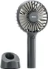 A gray portable fan and its charging stand are displayed against a white background. Náhled obrázku produktu