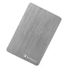 A close-up, top-down view of a silver external hard drive with a brushed metal finish. Podgląd zdjęcia produktu