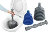 A hand is using a plunger in a toilet bowl, with other plungers displayed next to it. Produktbild-Vorschau