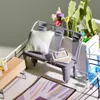 A miniature dollhouse scene on a balcony with a bench, plants, and a small table. Anteprima dell’immagine prodotto