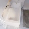 A clean, modern bathroom featuring a white bathtub. Produktbild-Vorschau
